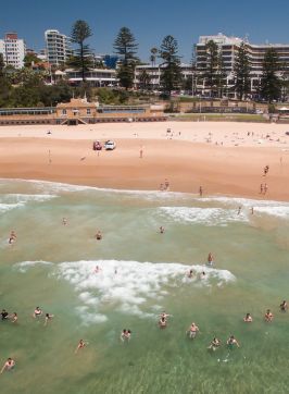 Aerial of swimmers enjoying a day at North Beach, Wollongong