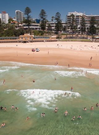 Aerial of swimmers enjoying a day at North Beach, Wollongong