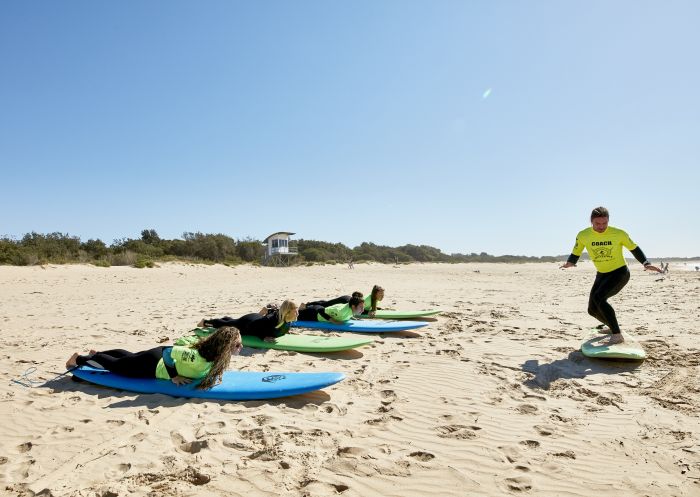 Illawarra Surf Academy, Wollongong Women learning how to surf with Illawarra Surf Academy on Corrimal Beach near Wollongong