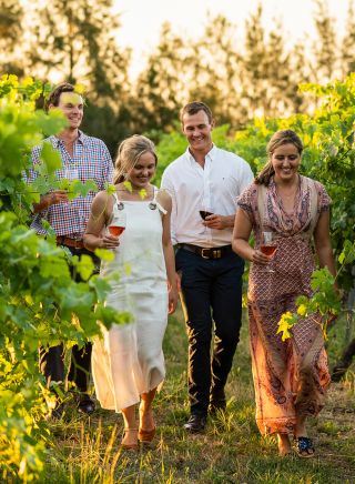 Couples enjoying food and wine at Grove Estate Wines, Young