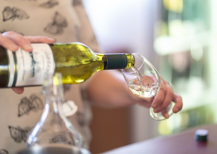 Glass of wine being poured at the Petersons Armidale Winery & Guesthouse in Armidale, Country NSW