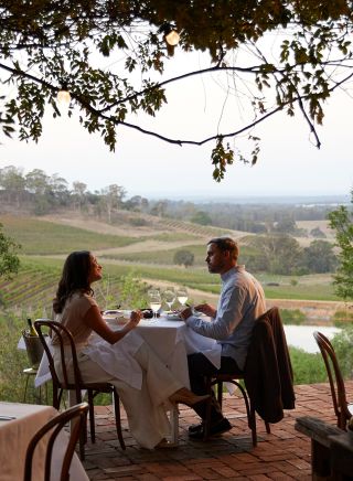 Couple enjoying food and drink at Bistro Molines, Mount View
