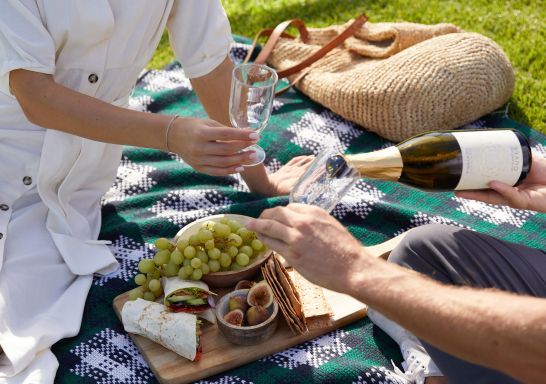 Couple enjoying a picnic in the scenic Japanese Garden and Cultural Centre, Cowra