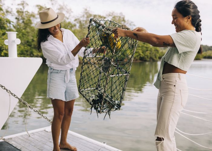 Catch A Crab, West Tweed Heads Women holding their catch during a Catch A Crab boat tour on the Tweed River, West Tweed Heads