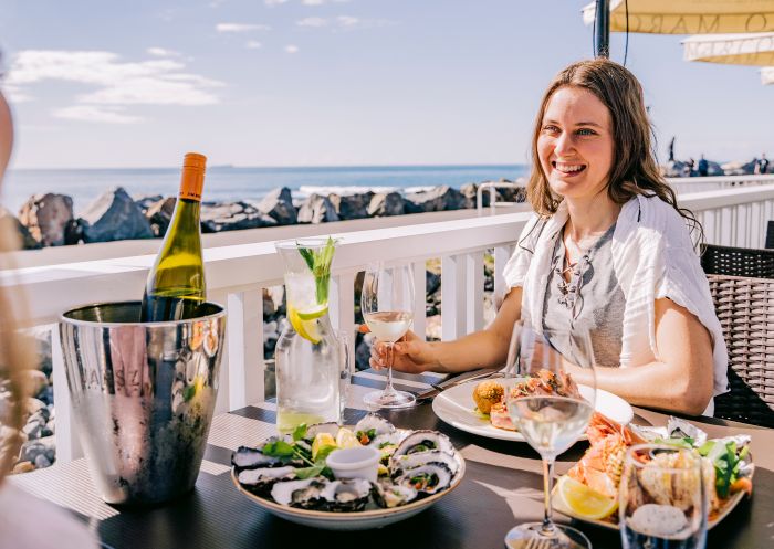 Friends enjoying food and drink at Latitude 30, Coffs Harbour