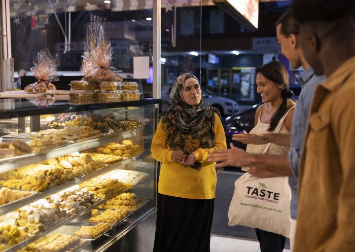 Asal Sweet, Merrylands Friends browsing the sweets on display at Asal Sweet, Merrylands