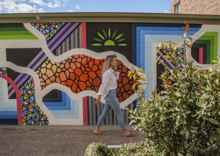 Woman enjoying the Public Art Walk, Goulburn located betweek the Goulburn Regional Art Gallery and the Goulburn Visitor Information Centre