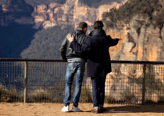 Couple looking at the scenic view at Govetts Leap Lookout, Blackheath