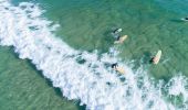 Surfers at Main Beach at Soul Surf School, Byron Bay