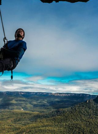 Man abseiling with the Blue Mountains Adventure Company, Blue Mountains
