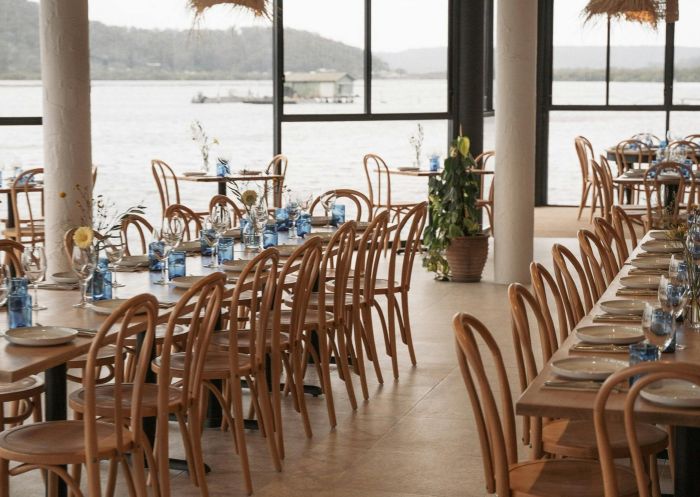 Dining area overlooking the water at Kefi, Koolewong