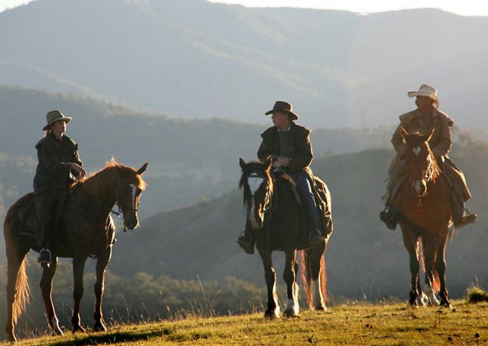 Riders on horses overlooking the ravines  of the Coxs River at Megalong Valley Farm, Megalong Valley