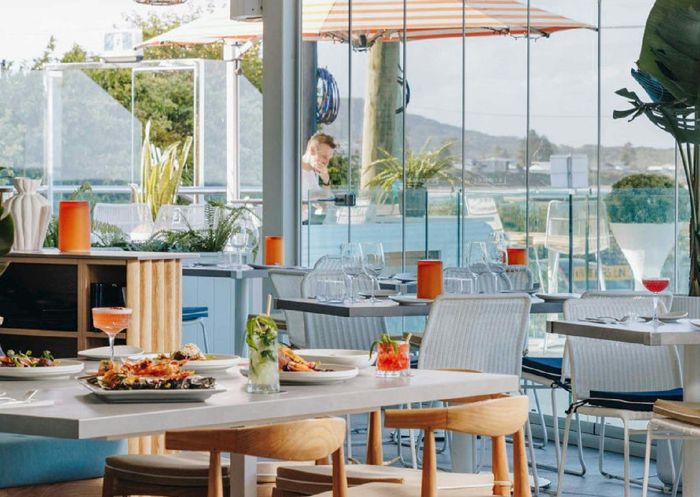 View of the sunlit dining room Swells Restaurant, Terrigal
