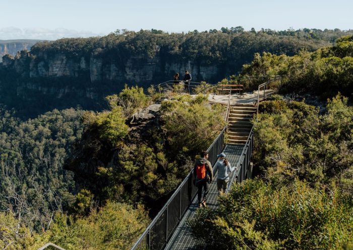 People walking along the Buttenshaw Bridge on the Grand Cliff Top Walk, Blue Mountains